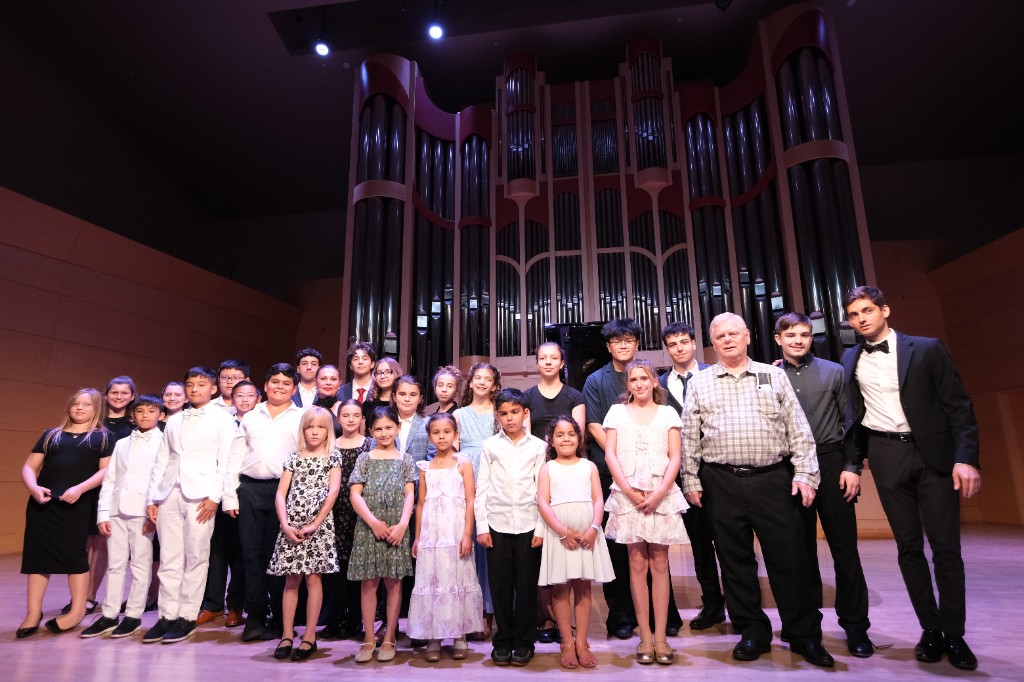 Artem Alexanian with students at the annual piano recital